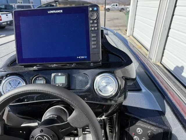 Slide: The Image of Dashboard of 2025 Phoenix 21 XE boat with Lowrance HDS12 display and gauges. - 17