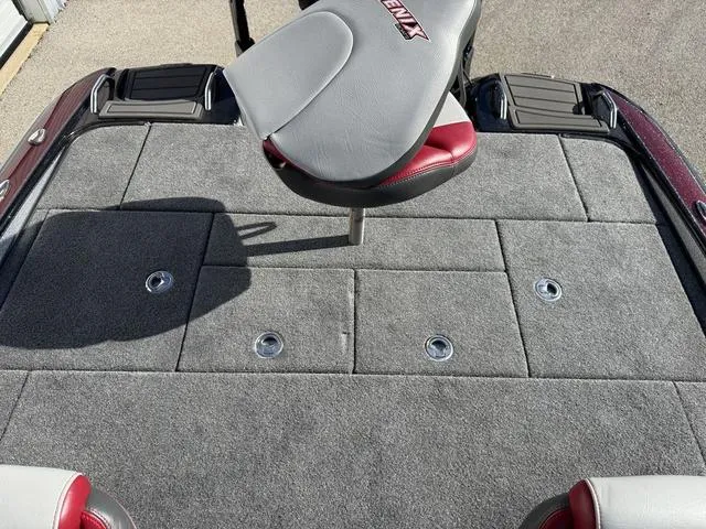 Slide: The Image of 2025 Phoenix 21 XE boat deck with gray carpet and seating. - 21