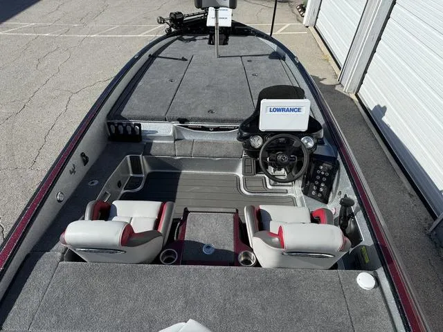 Slide: The Image of 2025 Phoenix 21 XE boat interior with dual seats and Lowrance navigation system. - 24