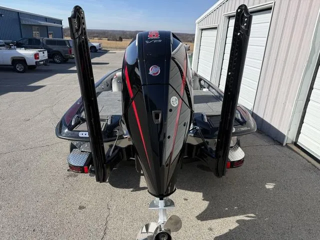 Slide: The Image of 2025 Phoenix 21 XE boat with powerful outboard motor in a sunny outdoor setting. - 5