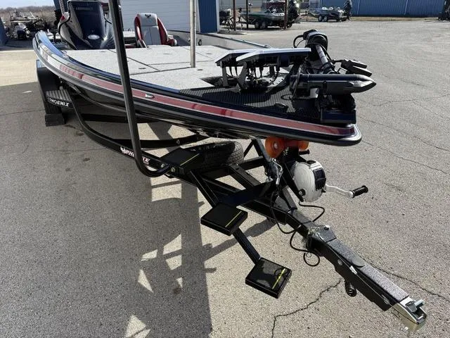 Slide: The Image of 2025 Phoenix 21 XE fishing boat on trailer, featuring advanced equipment and sleek design. - 7