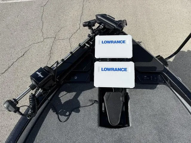 Slide: The Image of Phoenix 21 XE 2025 boat with Lowrance electronics and trolling motor on deck. - 8