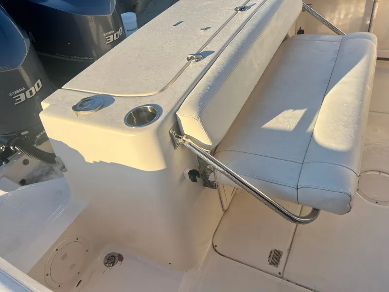 Slide: The Image of 2018 Grady-White Canyon 271 FS boat seating and engine area. - 11