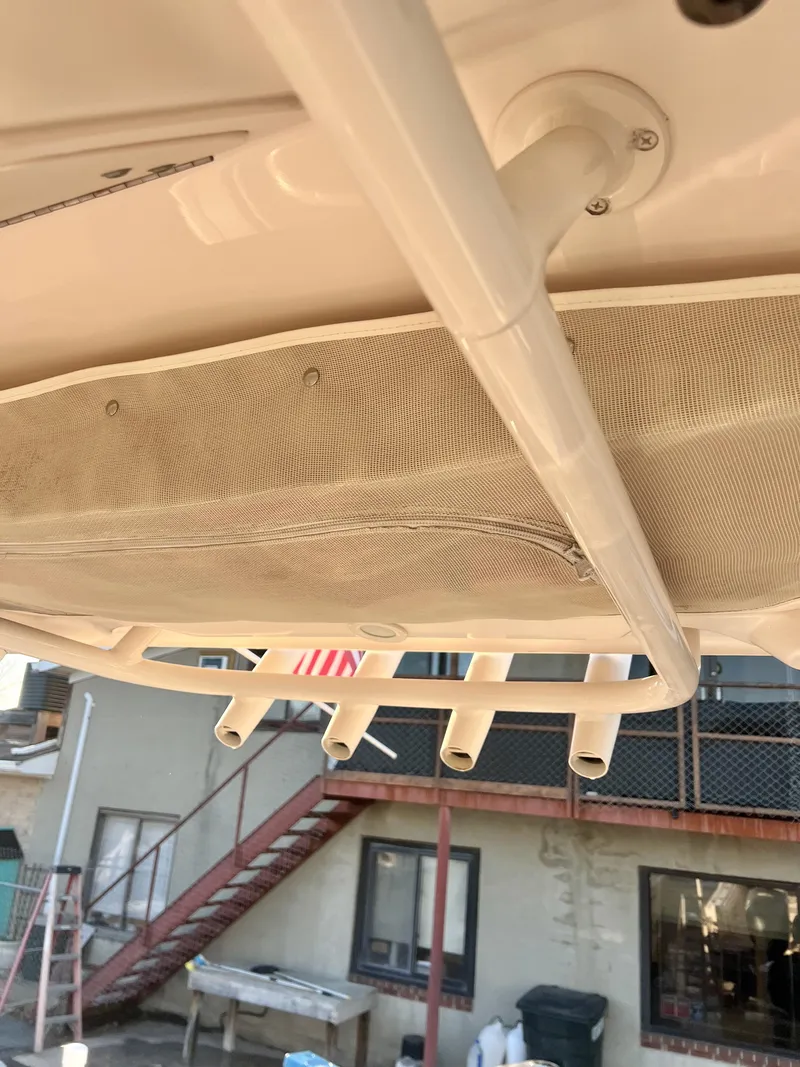 Slide: The Image of 2018 Grady-White Canyon 271 FS boat with rod holders and storage net. - 19