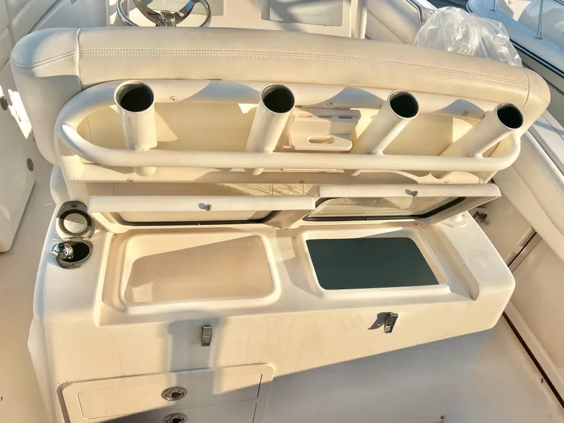 Slide: The Image of Grady-White Canyon 271 FS 2018 boat interior with rod holders and storage compartments. - 21