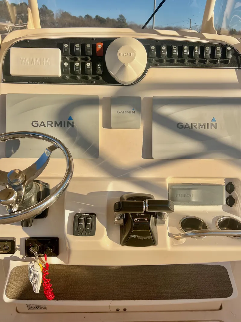 Slide: The Image of 2018 Grady-White Canyon 271 FS boat dashboard with Garmin navigation system. - 24