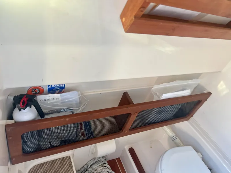 Slide: The Image of Interior of 2018 Grady-White Canyon 271 FS boat with storage compartments. - 27