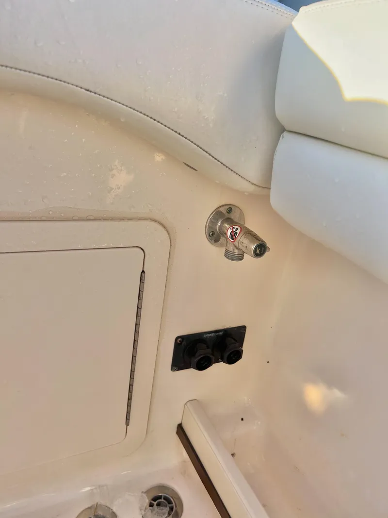Slide: The Image of 2018 Grady-White Canyon 271 FS boat interior detail with storage compartment and fixtures. - 31