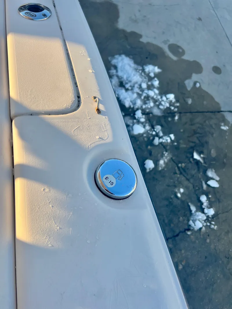 Slide: The Image of Close-up of 2018 Grady-White Canyon 271 FS boat detail with snow on the ground. - 34