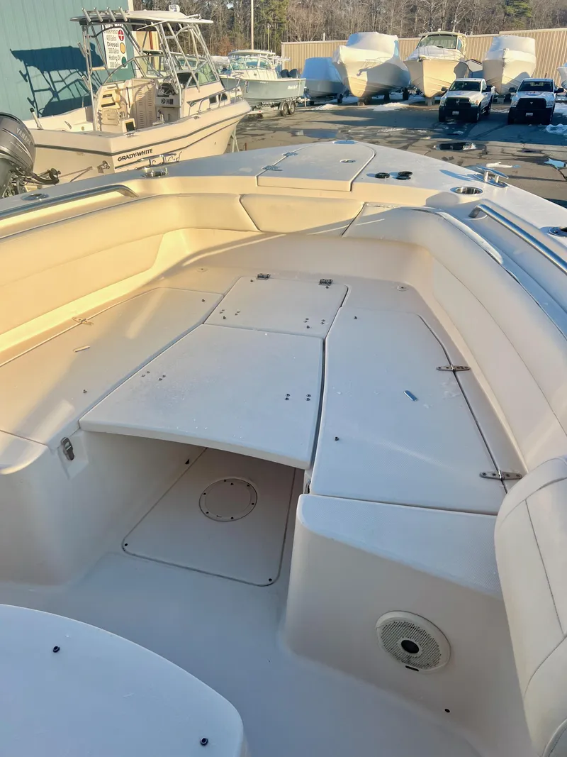 Slide: The Image of 2018 Grady-White Canyon 271 FS boat deck, spacious seating, and storage compartments. - 35