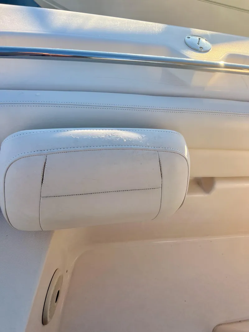 Slide: The Image of 2018 Grady-White Canyon 271 FS boat interior detail with white upholstery. - 38