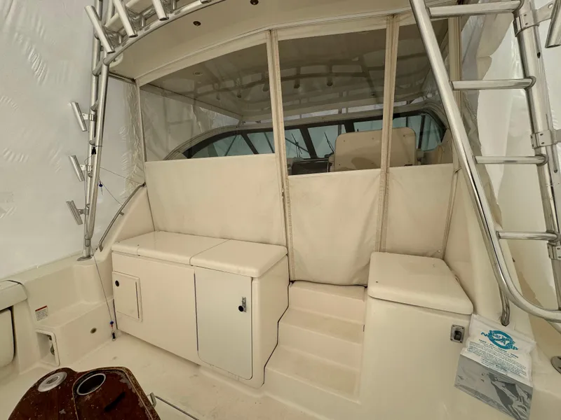 Slide: The Image of 2004 Tiara Yachts 4200 Open interior with seating and storage. - 11