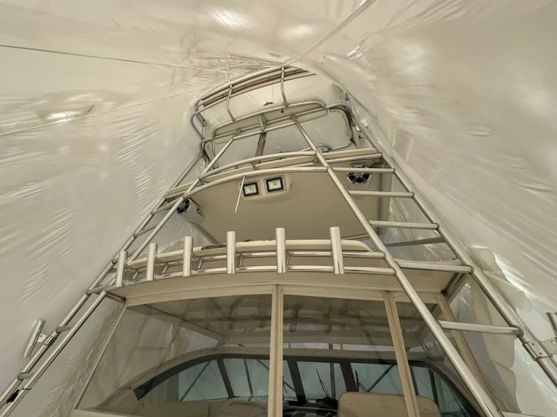 Slide: The Image of 2004 Tiara Yachts 4200 Open interior with ladder and covered deck. - 12