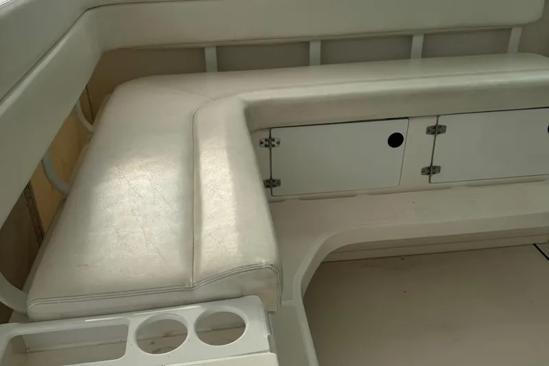 Slide: The Image of 2004 Tiara Yachts 4200 Open interior seating with storage compartments. - 16