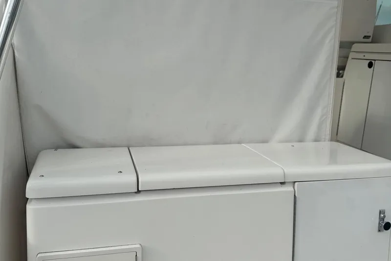 Slide: The Image of 2004 Tiara Yachts 4200 Open interior seating and storage area. - 17