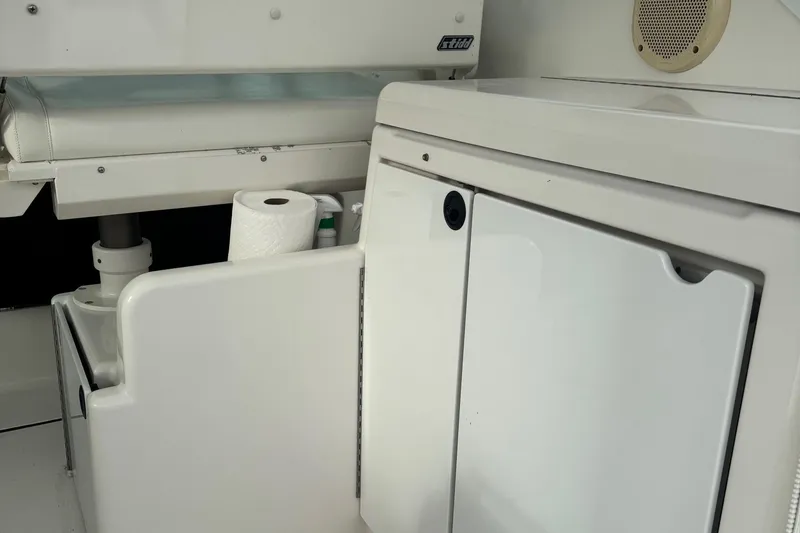 Slide: The Image of 2004 Tiara Yachts 4200 Open interior with storage and seating area. - 21