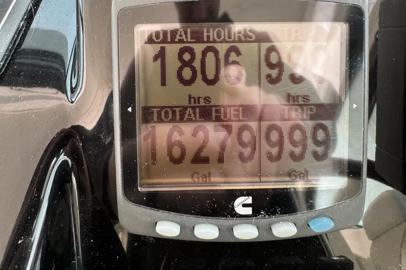 Slide: The Image of Display panel of 2004 Tiara Yachts 4200 Open showing engine hours and fuel usage. - 29