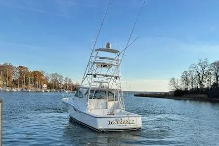 Slide: The Image of 2004 Tiara Yachts 4200 Open cruising on a serene waterway. - 3