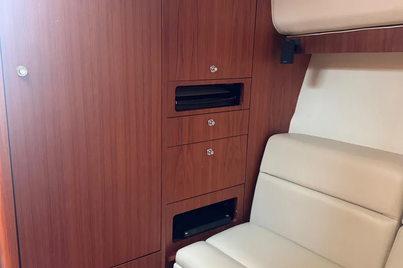 Slide: The Image of Interior of 2004 Tiara Yachts 4200 Open with wood cabinetry and beige seating. - 41