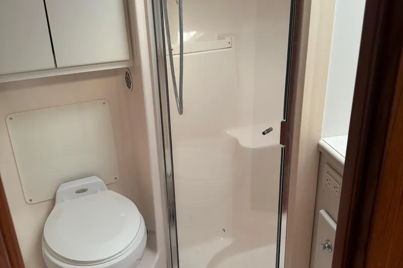 Slide: The Image of 2004 Tiara Yachts 4200 Open bathroom with shower and toilet. - 47
