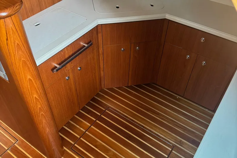 Slide: The Image of 2004 Tiara Yachts 4200 Open interior with wooden cabinetry and flooring. - 49