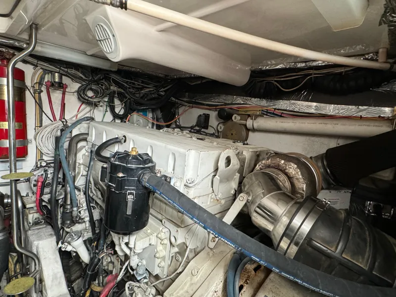 Slide: The Image of Engine room of 2004 Tiara Yachts 4200 Open, showcasing complex machinery and wiring. - 53