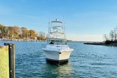 Slide: The Image of 2004 Tiara Yachts 4200 Open on a serene lake with autumn trees. - 7