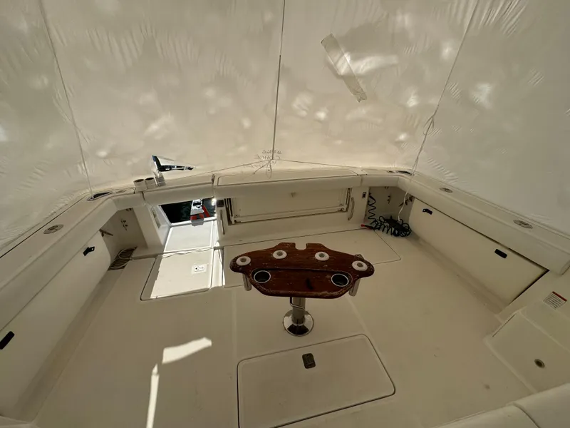 Slide: The Image of 2004 Tiara Yachts 4200 Open cockpit with fishing rod holders and storage. - 9