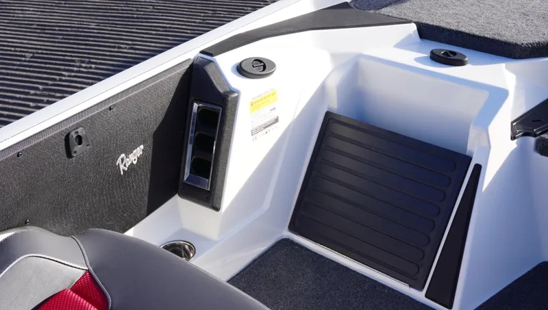 Slide: The Image of 2025 Ranger Z520 boat interior with storage compartment and seating area. - 10