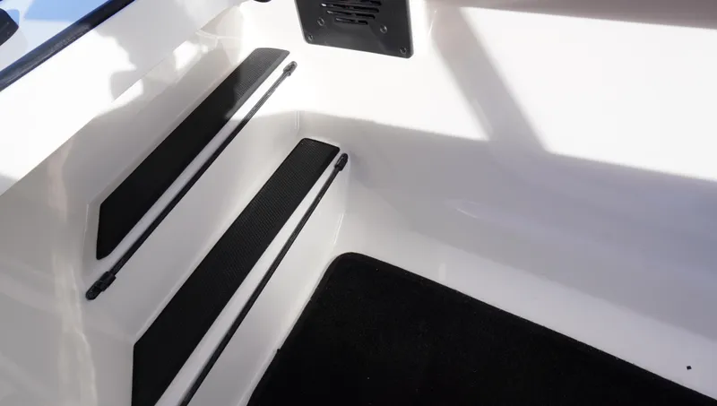 Slide: The Image of 2025 Ranger Z520 boat interior steps with black non-slip pads. - 14