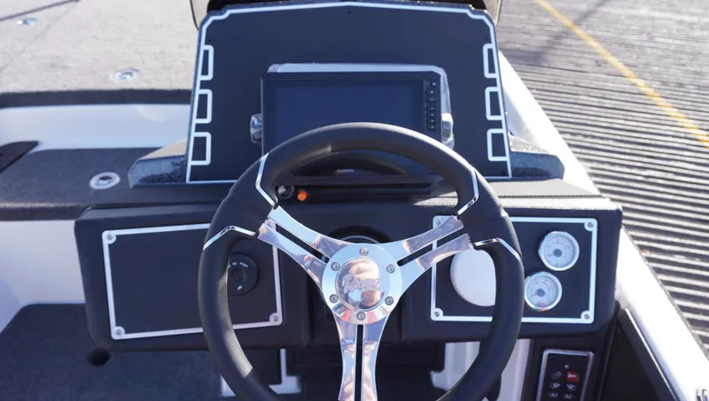 Slide: The Image of 2025 Ranger Z520 boat dashboard with steering wheel and digital display. - 9