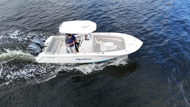 Slide: The Image of 2017 Tidewater 252 LXF boat cruising on open water. - 10