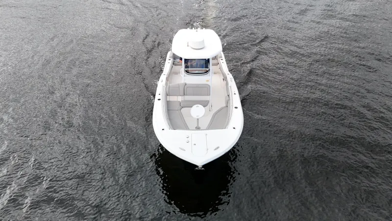 Slide: The Image of Aerial view of 2017 Tidewater 252 LXF boat cruising on water. - 7