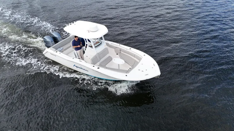 Slide: The Image of 2017 Tidewater 252 LXF boat cruising on open water. - 8