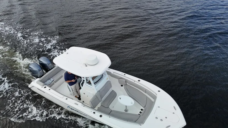 Slide: The Image of Aerial view of 2017 Tidewater 252 LXF boat cruising on water. - 9