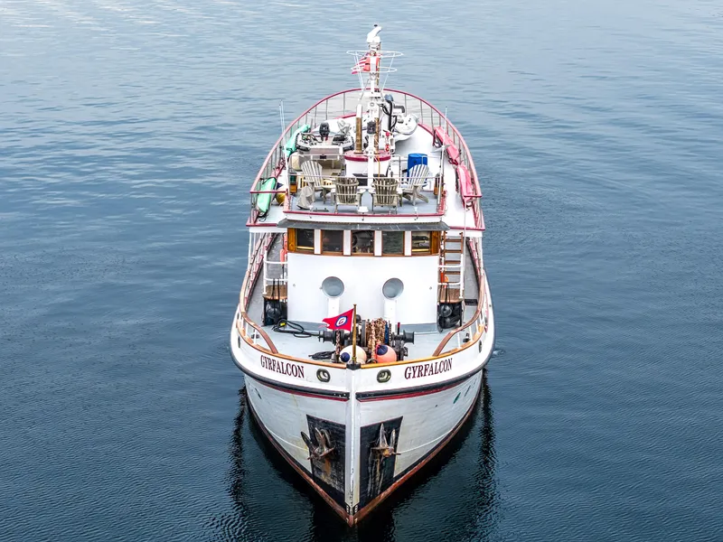 Slide: The Image of 1941 Custom Sagstad Fantail boat on calm water, front view. - 10