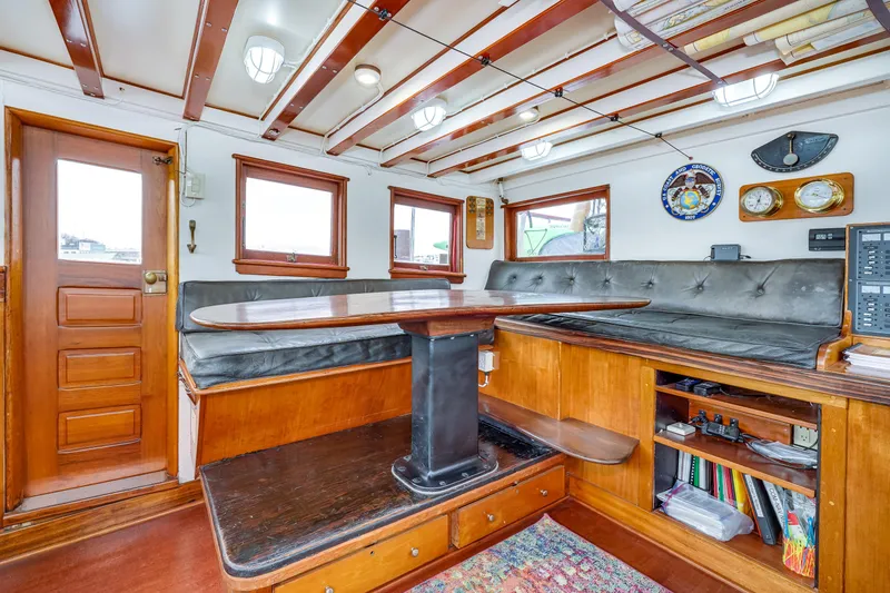 Slide: The Image of Interior of 1941 Custom Sagstad Fantail boat with wooden furnishings and nautical decor. - 22