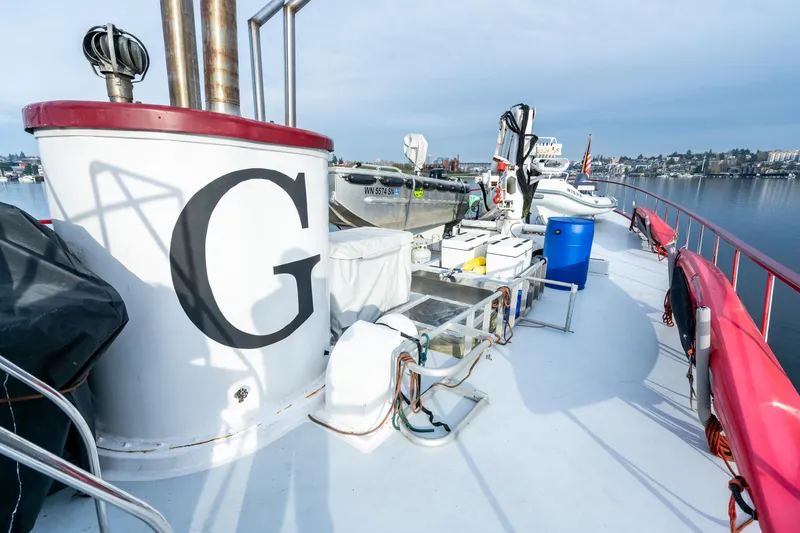 Slide: The Image of 1941 Custom Sagstad Fantail boat deck with equipment and large "G" marking. - 26
