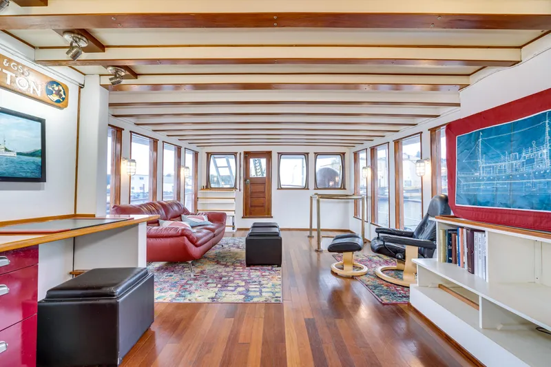 Slide: The Image of Spacious 1941 Custom Sagstad Fantail interior with wooden beams, modern furnishings, and large windows. - 28