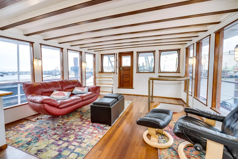 Slide: The Image of Luxurious interior of 1941 Custom Sagstad Fantail boat with modern seating and panoramic windows. - 3