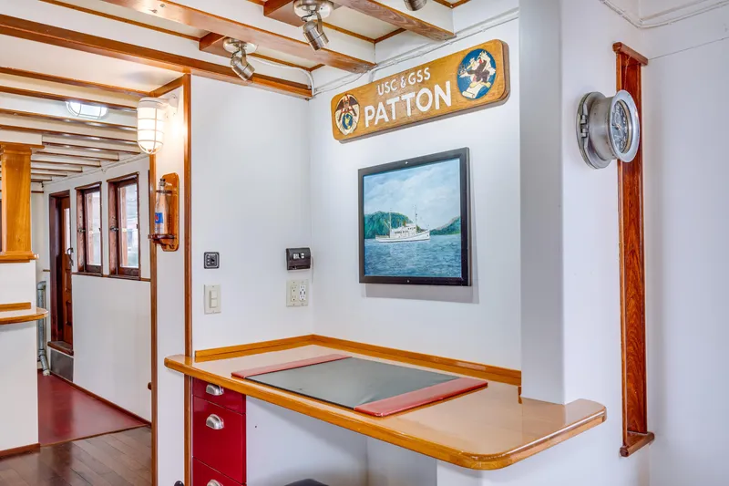 Slide: The Image of Interior of 1941 Custom Sagstad Fantail boat with nautical decor and wooden accents. - 34