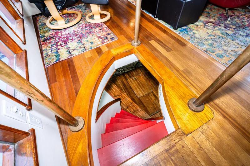 Slide: The Image of Interior of 1941 Custom Sagstad Fantail with wooden floors and red spiral staircase. - 41