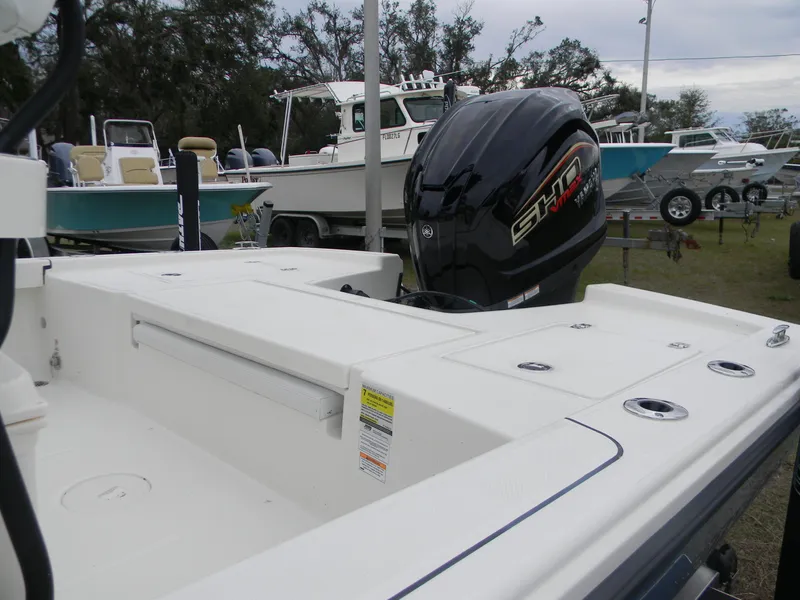 Slide: The Image of 2025 Pathfinder 2200 TRS boat with Yamaha engine, displayed outdoors. - 3