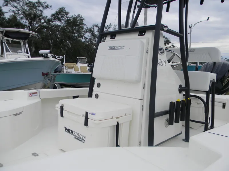 Slide: The Image of 2025 Pathfinder 2200 TRS boat interior with storage compartments and seating. - 4