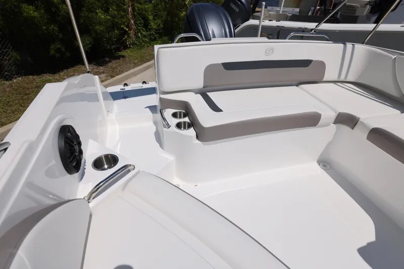 Slide: The Image of 2025 Hurricane SunDeck 235 OB boat interior with cushioned seating and cup holders. - 10