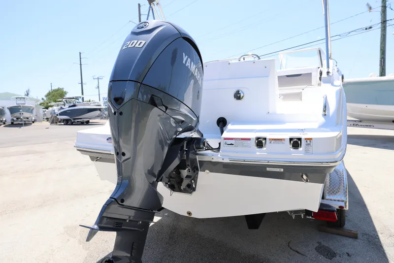 Slide: The Image of 2025 Hurricane SunDeck 235 OB with Yamaha 200 outboard motor, rear view. - 12