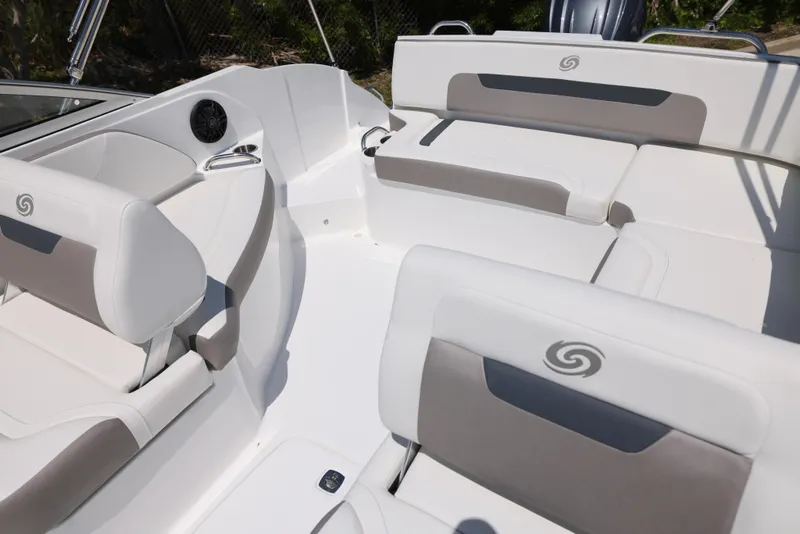Slide: The Image of 2025 Hurricane SunDeck 235 OB boat interior with white and gray seating. - 14