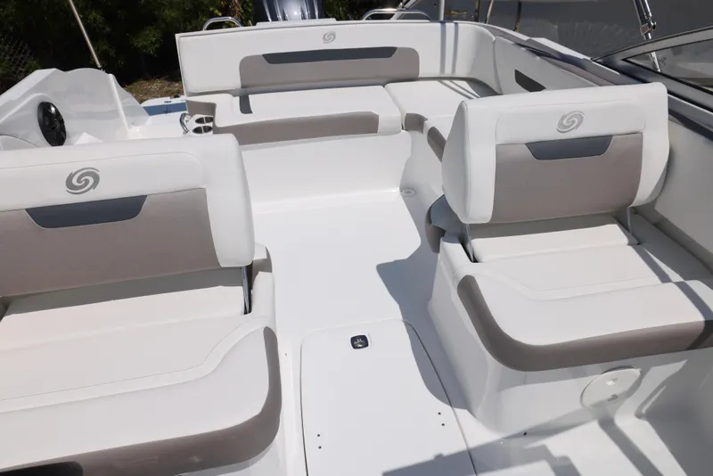 Slide: The Image of 2025 Hurricane SunDeck 235 OB boat interior with white and gray seating. - 15