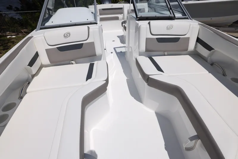 Slide: The Image of 2025 Hurricane SunDeck 235 OB boat interior with spacious seating and modern design. - 26