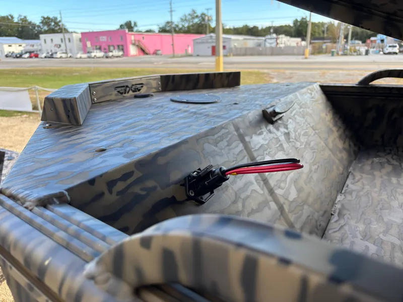 Slide: The Image of 2025 Edge Duck Boats 553 DB with camouflage design, featuring a sturdy build and wiring detail. - 7